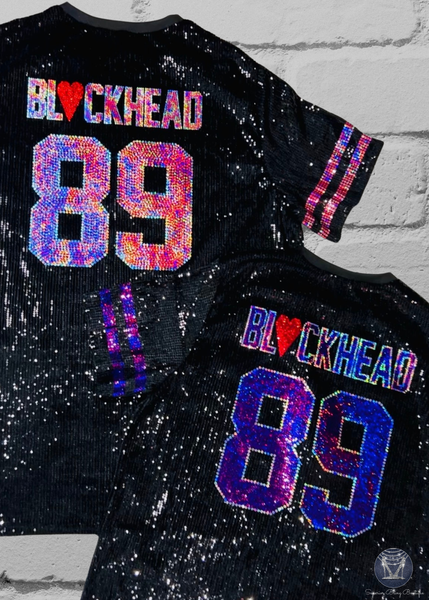 Black Sequin Dresses with custom text and numbers on the back. One uses light pink and silver bling and the other uses purple and silver bling. One dress has light pink sleeve stripes and the other has purple.