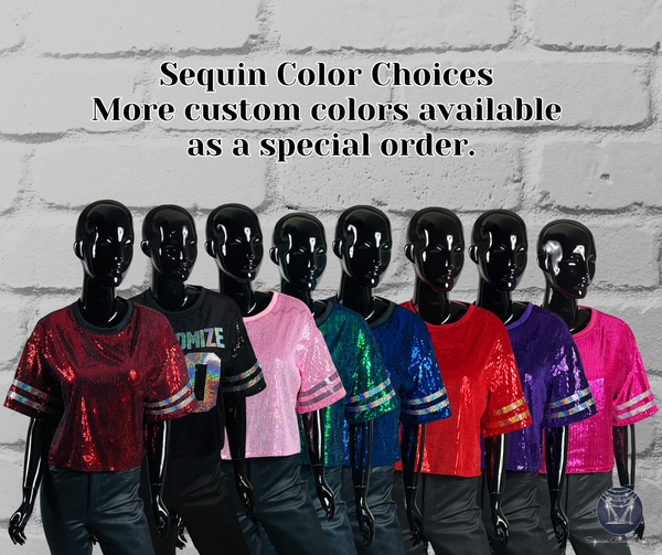 A lineup of mannequins wearing short-sleeve sequin t-shirts in multiple colors, including red, pink, green, blue, red, purple, and fuchsia, with text above reading 'Sequin Color Choices More custom colors available as a special order.'.
